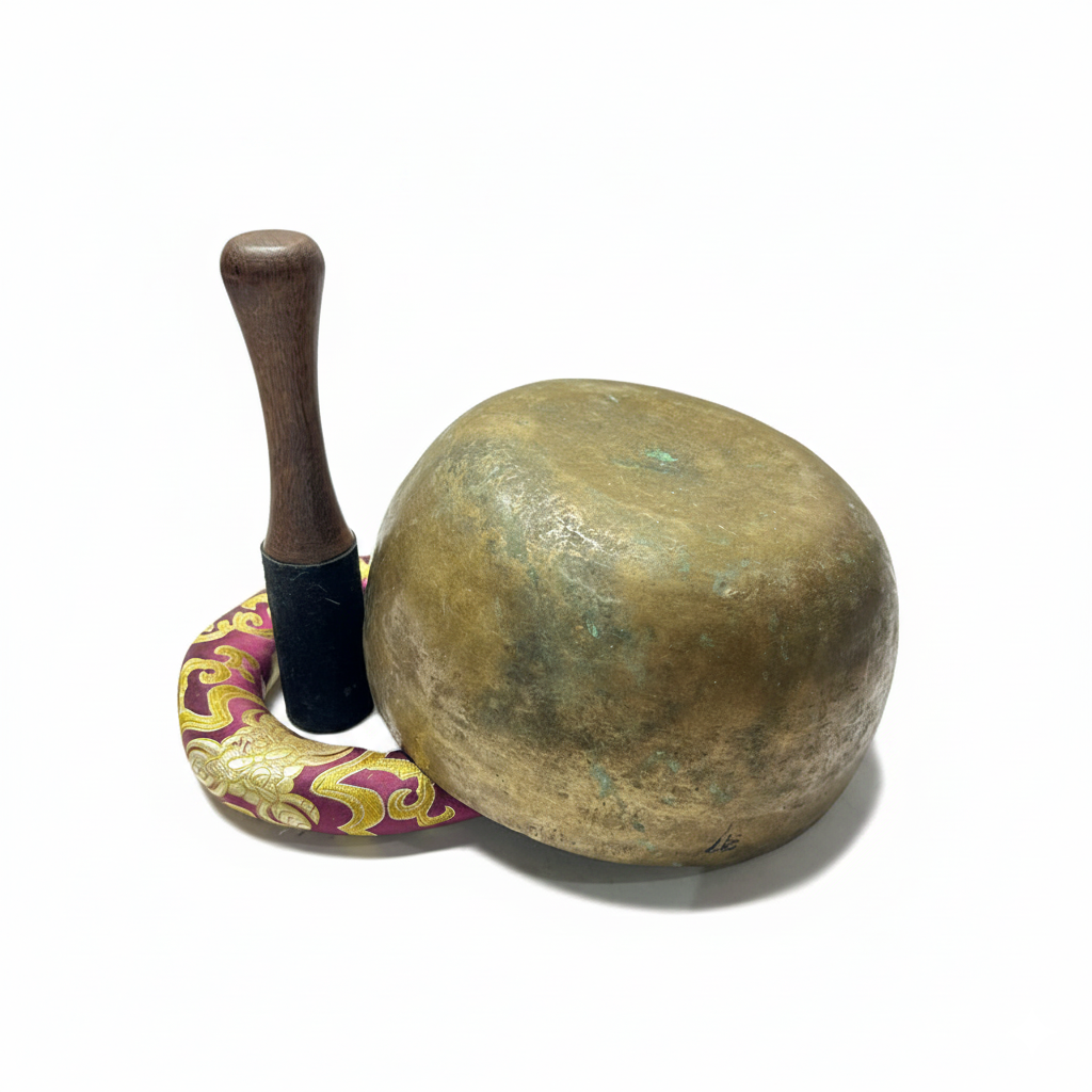 Experience the peaceful energy of the Himalayas with this vintage old antique handmade singing bowl made in Nepal. Carefully handcrafted by skilled Nepalese artisans using traditional Himalayan techniques, this authentic meditation bowl produces deep, soothing tones and long-lasting vibrations perfect for sound healing, yoga, mindfulness, Reiki, and spiritual meditation practices. The calming resonance of the bowl helps create a relaxing atmosphere that supports inner peace, stress relief, chakra balancing, and emotional healing. Inspired by ancient Tibetan Buddhist traditions, this handmade sound bowl is widely used for meditation sessions, yoga studios, sound baths, and spiritual rituals. Featuring a beautiful antique vintage finish and unique handcrafted details, every singing bowl has its own individual tone and character. Its rich harmonic sound gently clears negative energy and encourages focus, relaxation, and mindful awareness. Perfect for meditation practitioners, healers, yoga teachers, and spiritual seekers, this authentic Himalayan singing bowl is both a meaningful healing instrument and a beautiful piece of traditional Nepalese craftsmanship. Handcrafted Old Antique Tibetan Singing Bowl – Traditional Nepal Singing Bowl